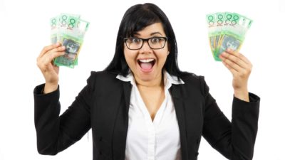 excited person holding australian cash in both hands