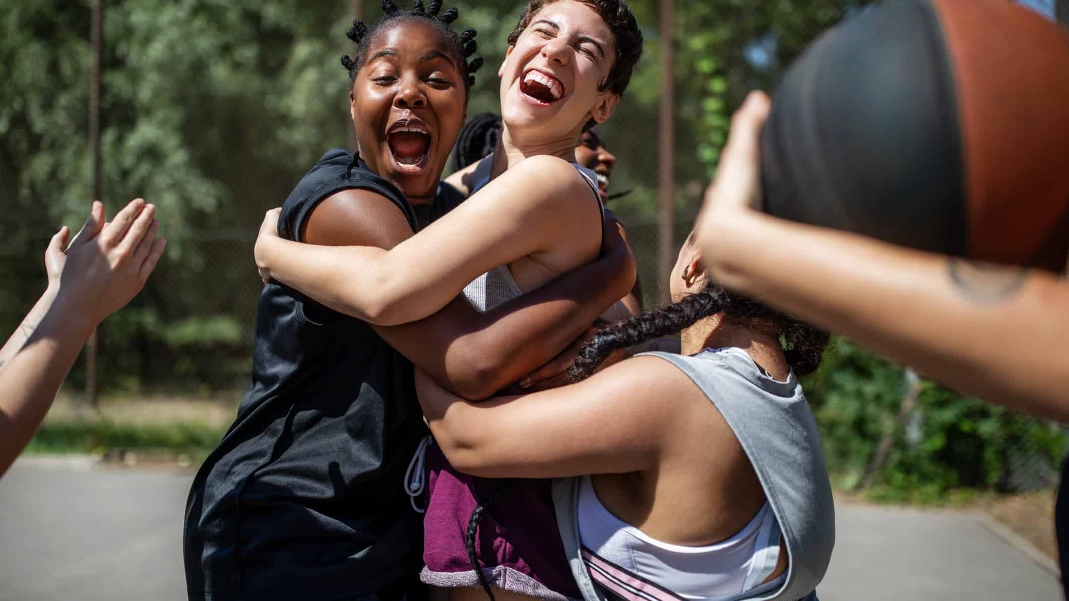 Teens having fun on the basketball court