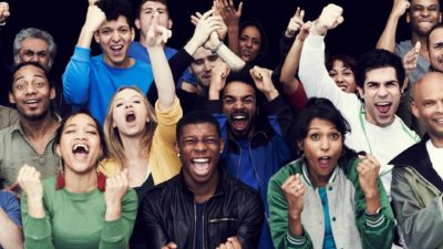 Diverse group of people enjoying a win