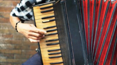 close up of piano accordian being played