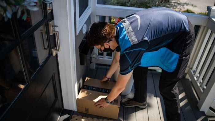 guy delivering Amazon parcel