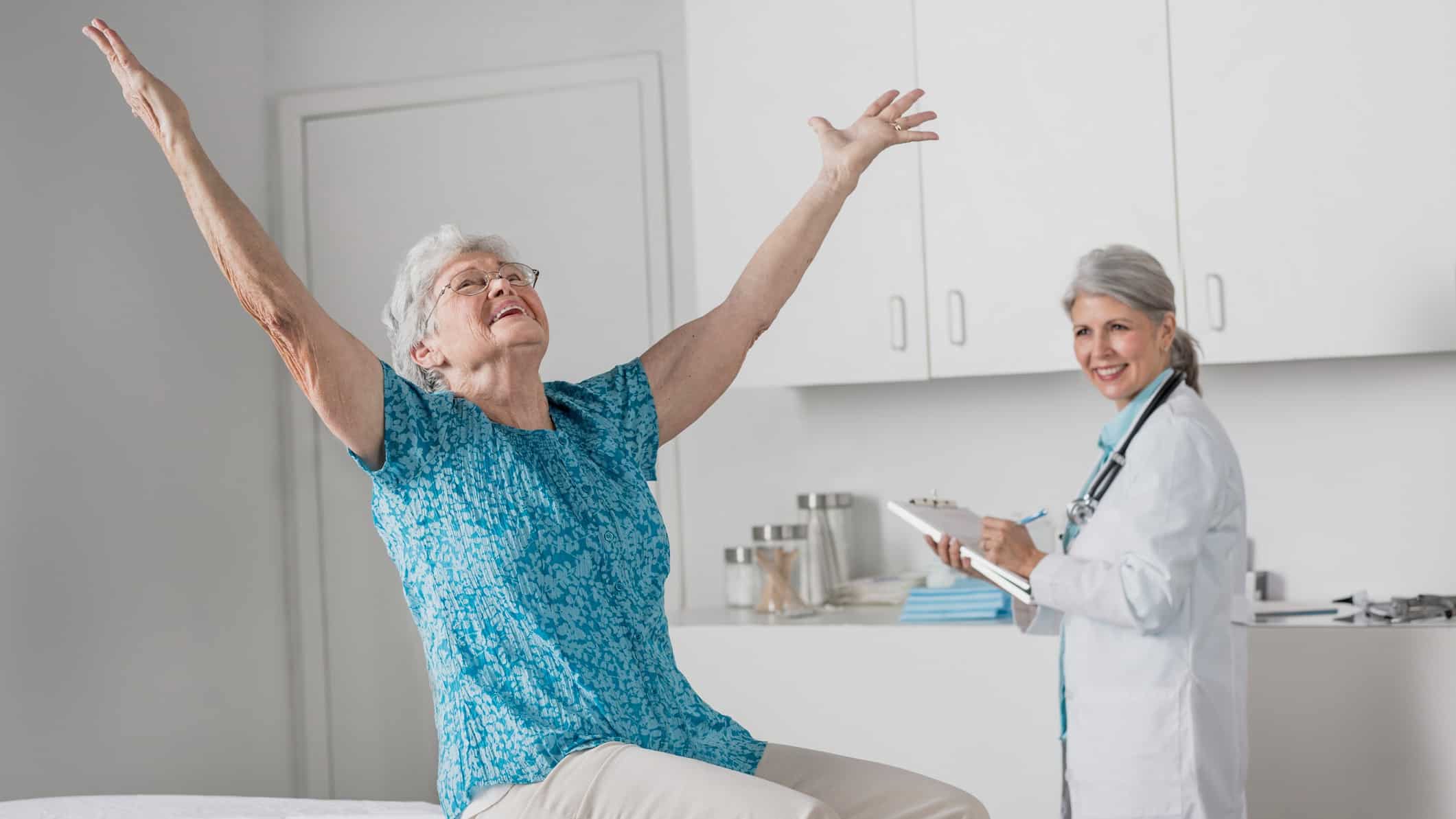 elderly woman cheers in doctor's office