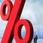 red percentage sign with man looking up which represents high interest rates