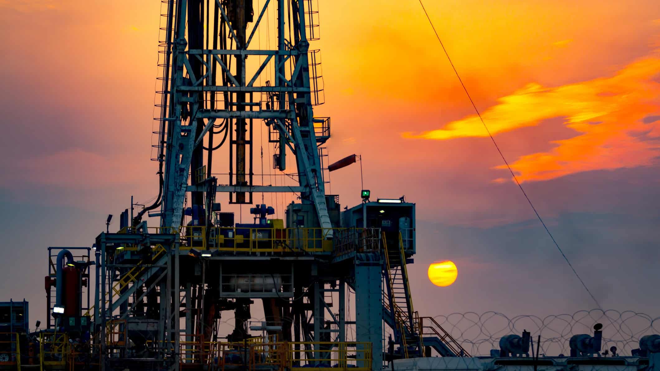 off shore drilling operation at sunset