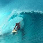 Surfer riding a wave.
