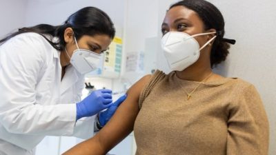 woman getting the Covid 19 vaccine