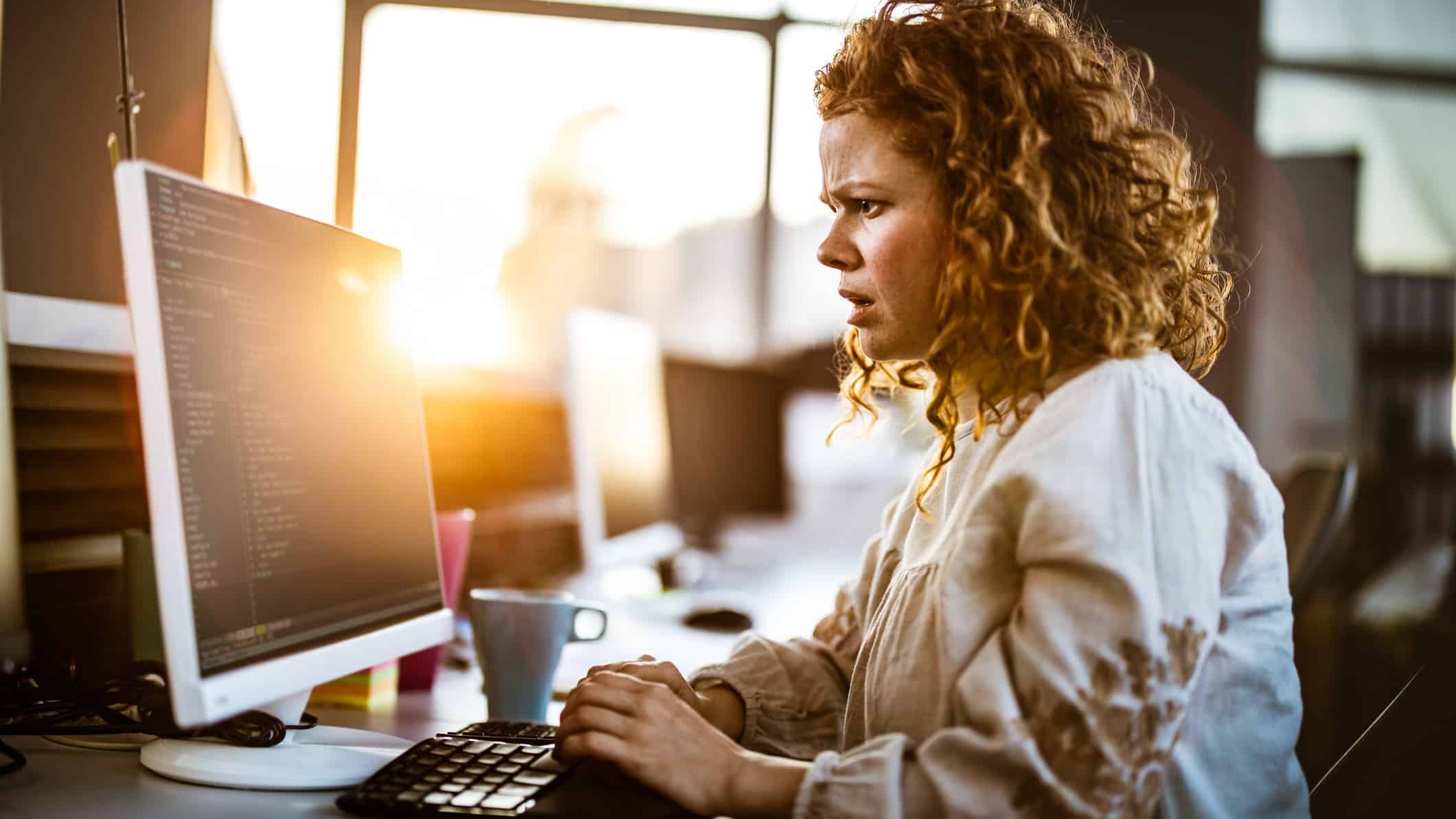 woman at computer disappointed