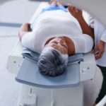 Woman going for a scan reassured by doctor