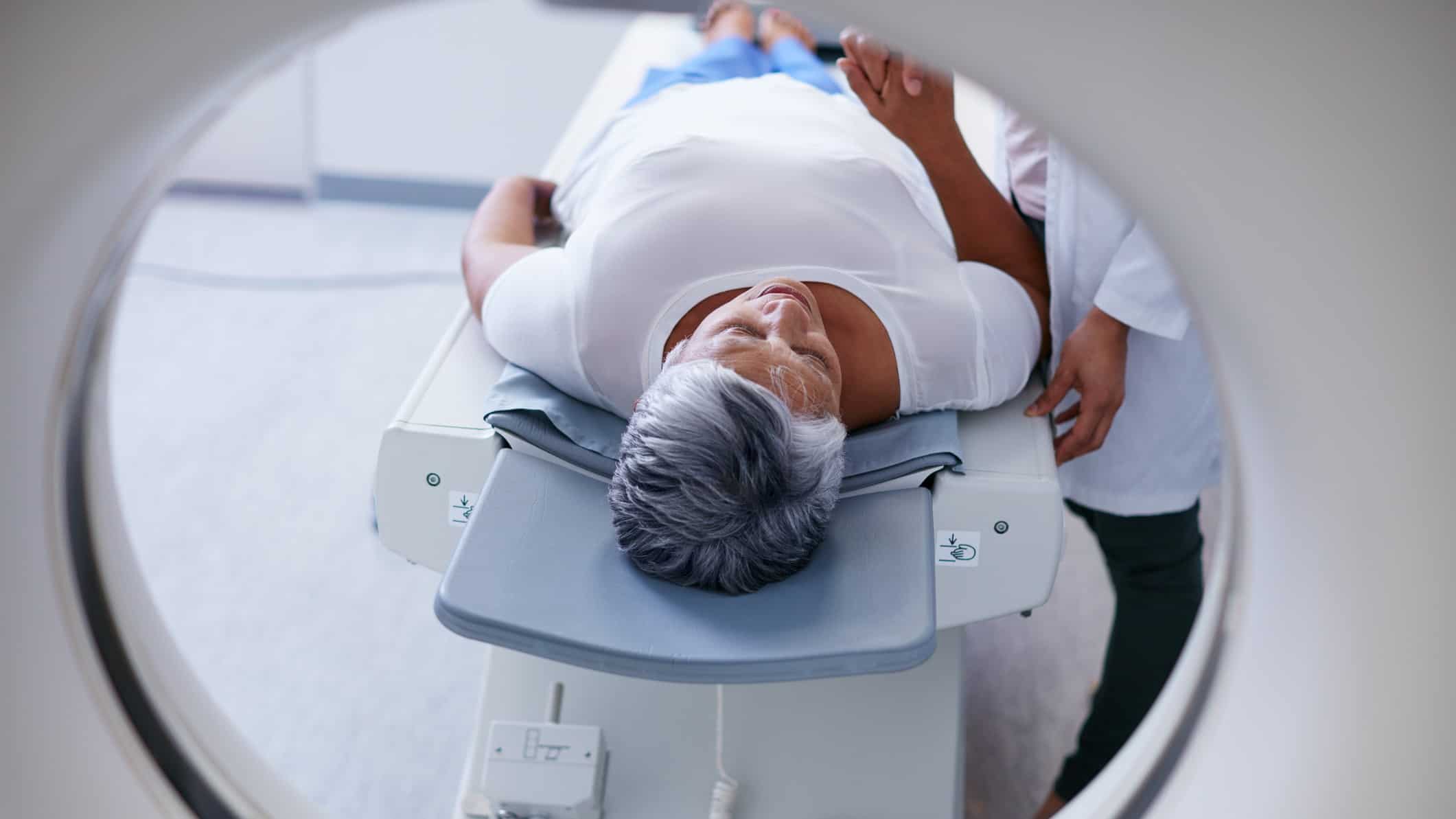 Woman going for a scan reassured by doctor