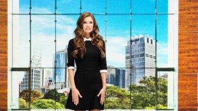 Businesswoman standing at the office lobby and is in shock