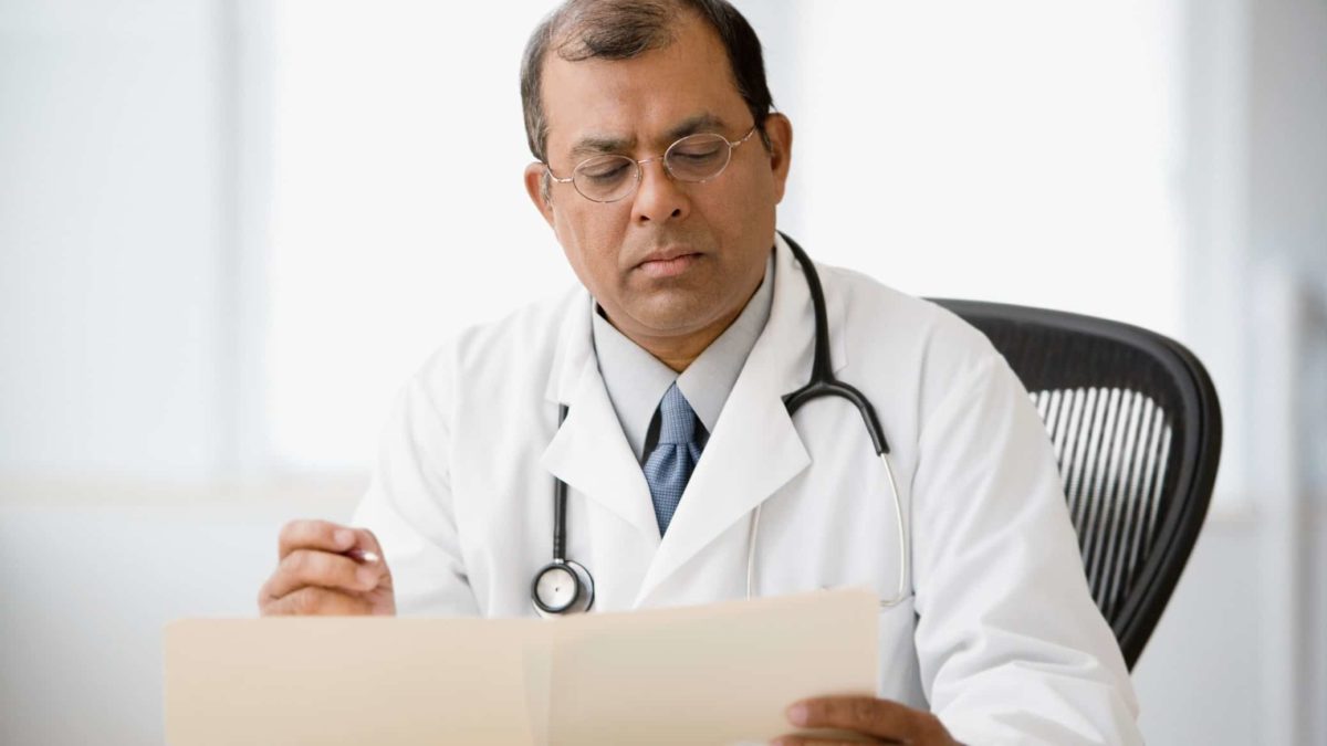 Doctor reading a file