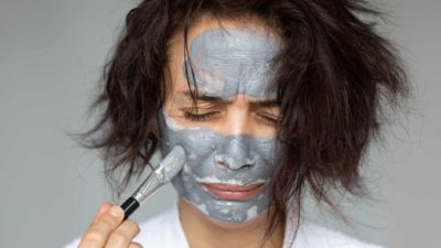 woman in skincare face mask looking sad, beauty product share price drop