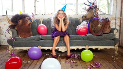 sad party goer sitting alone after celebration