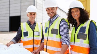 three Lendlease builders on construction site