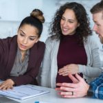 happy investors around computer, young investors, loans, finance