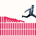An ASX 200 share investor runs and leaps over rows and rows of blocks, as they topple in his wake.