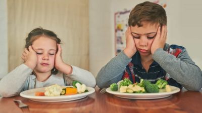 sad eaters with food, meal preparation companies, unhappy children with vegetables, food share price decrease, drop, slump