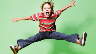 Happy child jumping for joy.