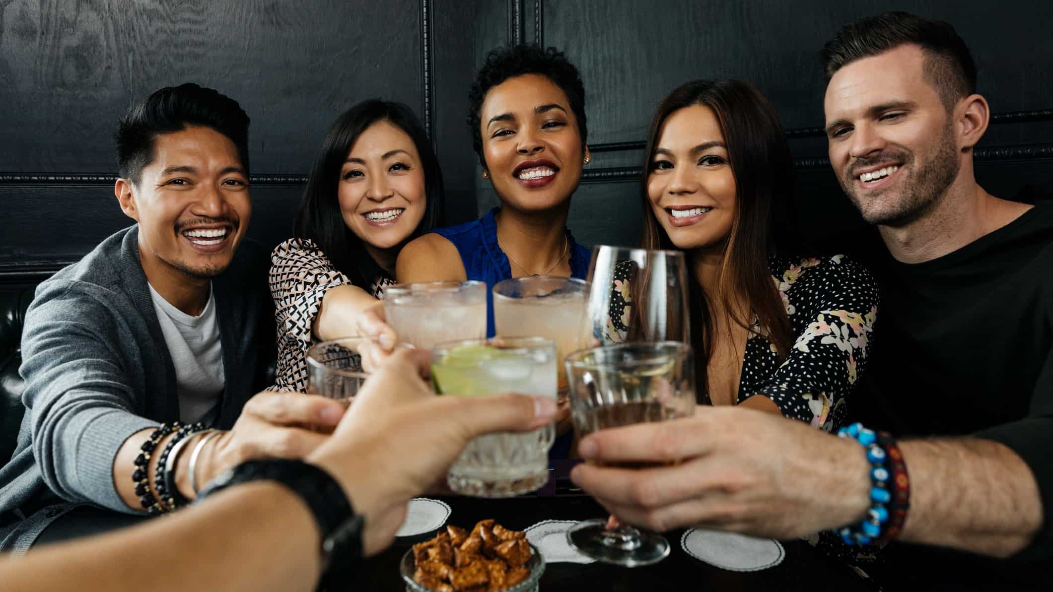 Group of friends toasting with drinks
