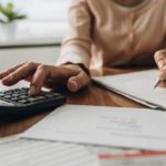 A person using a calculator.