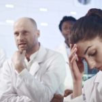 laboratory workers looking disappointed