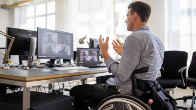 man in wheelchair on zoom call