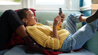 Woman relaxing and using her Apple device