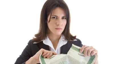 woman ripping a notice paper