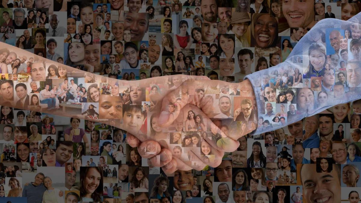 two people shaking hands in front of montage of faces