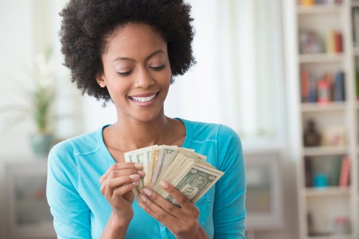Woman holding some cash