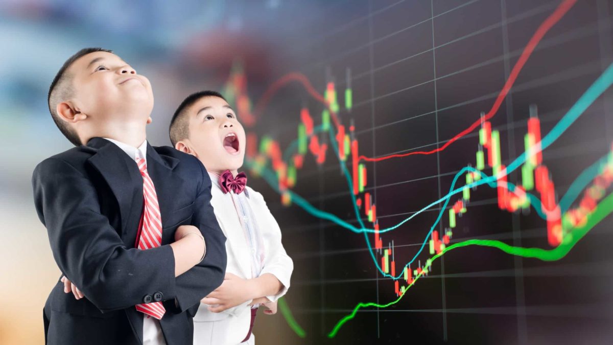 young boys open mouthed in front of shares graph