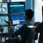 Man online with computers discussing the ASX 200