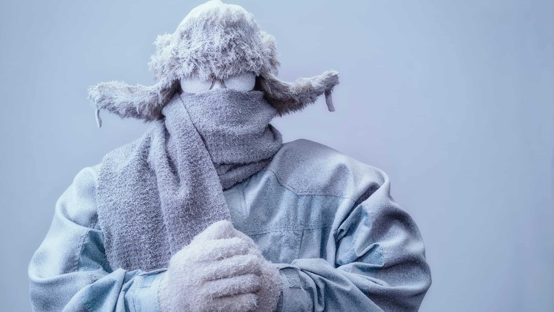 Person covered in snow and freezing