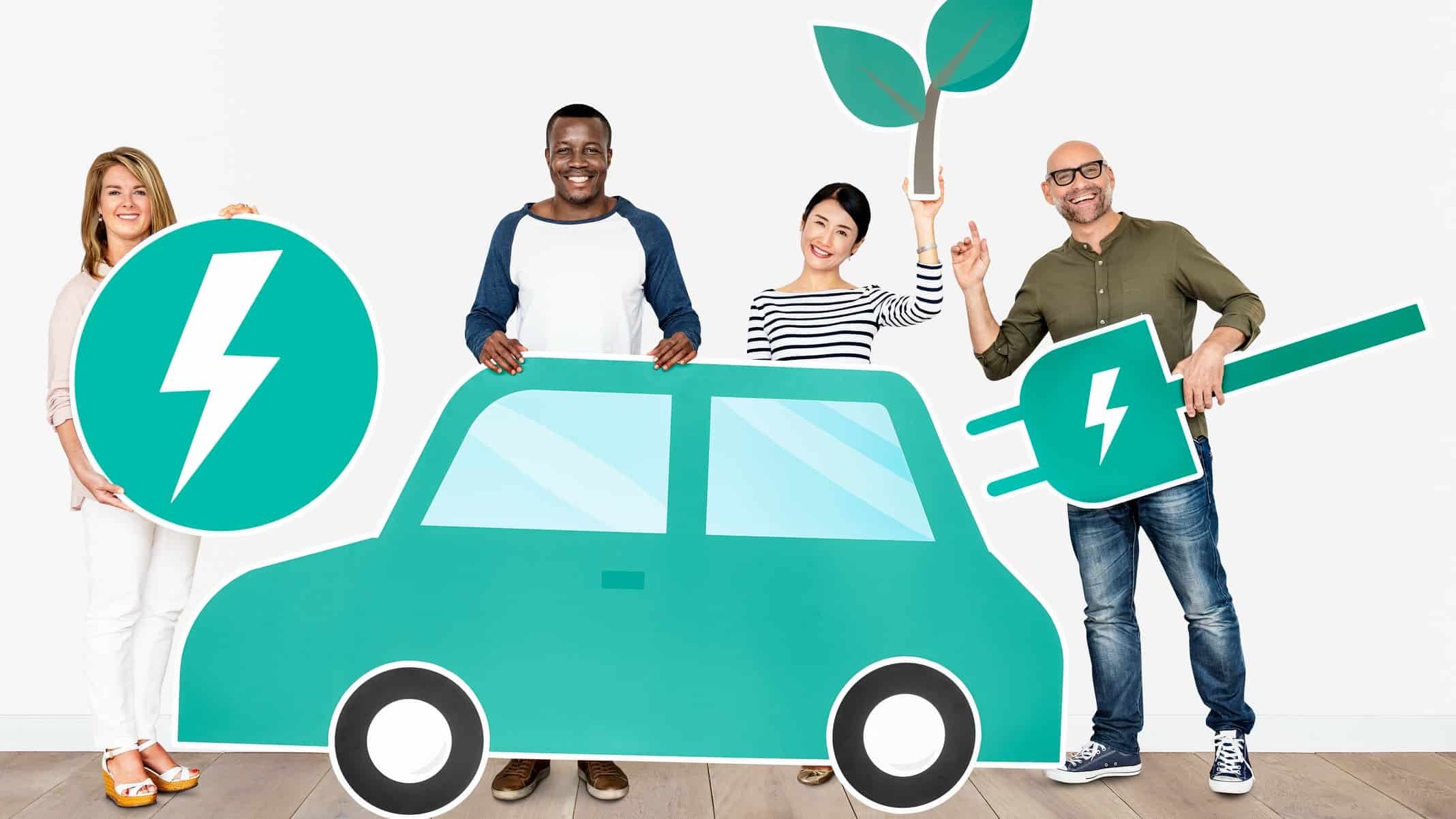 a group of four people pose behind a graphic image of a green car, holding various symbols of clean electric, lithium powered energy including energy symbols and a green plant.