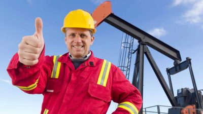 Oil worker drilling on the oil field