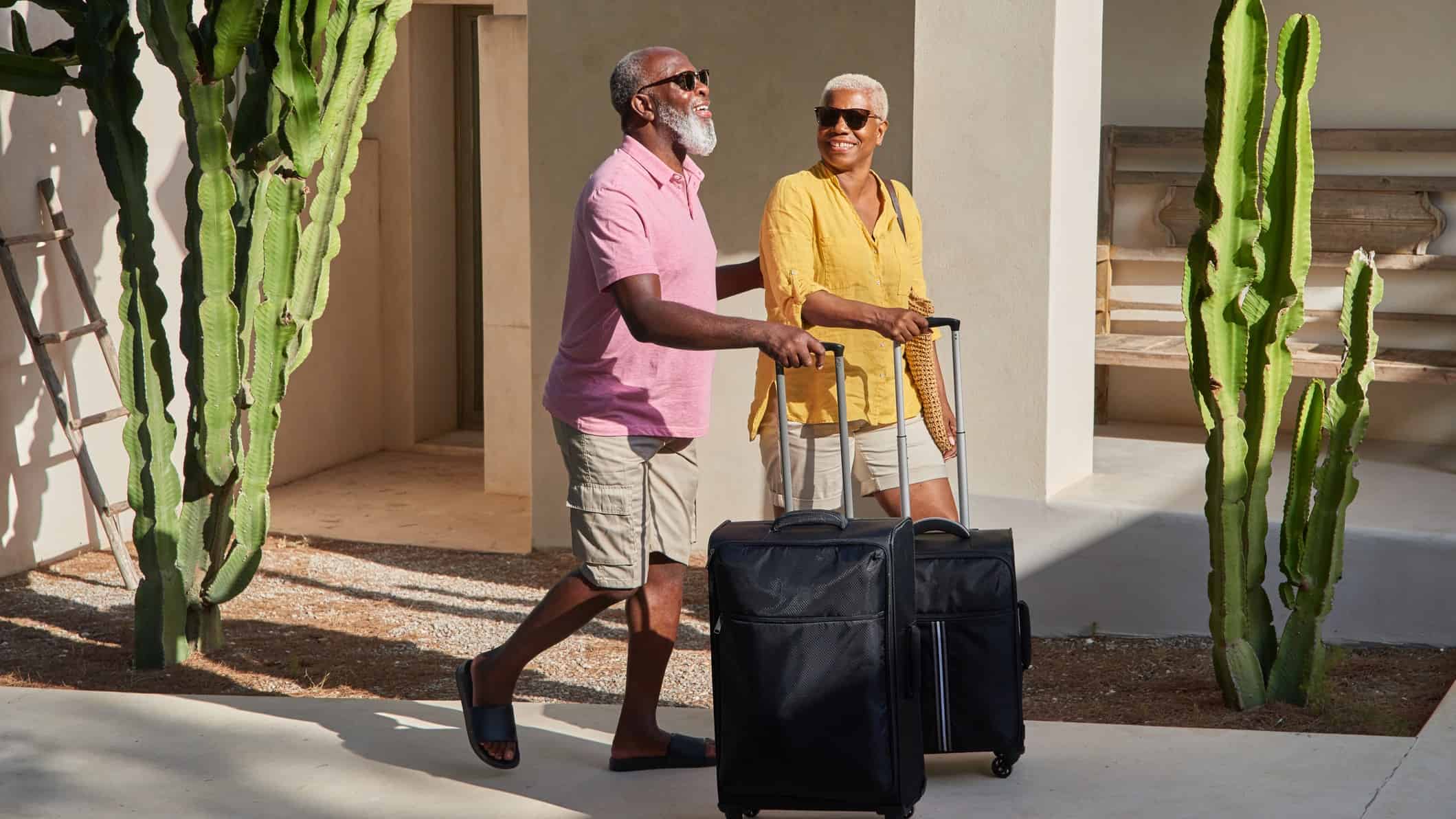 couple heads off on holiday with suitcase