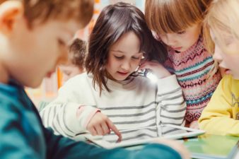 Education with the kids using a tablet for learning