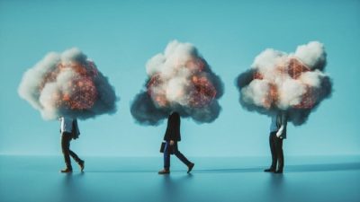 Three people walk in a line with their heads obscured by dark clouds.