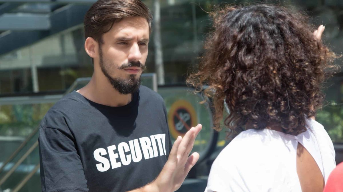 Security guard stops woman entering