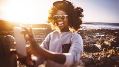 woman using snapchat on her smartphone