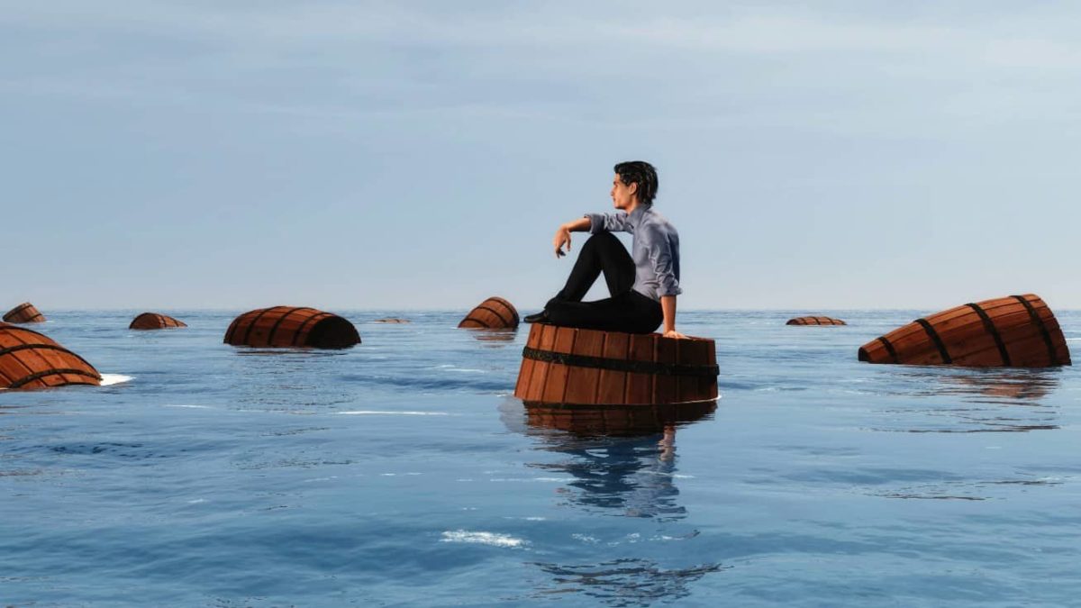 A businessman sits on a wine barrel floating at sea
