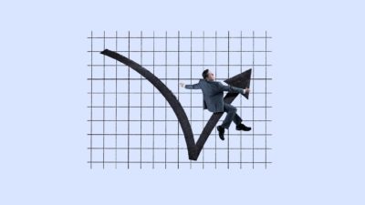 a man in a business suit rides a graphic image of an arrow that is rebounding after hitting the low point on a grid pattern that serves as a background to the image.