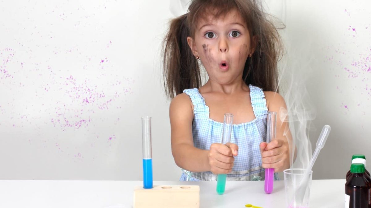 A little girl is surprised at a science experiment.