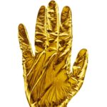 A gold gloved hand is held up in a stop gesture.
