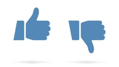 two Facebook "thumbs up" like symbols appear side by side with one pointing downwards in a thumbs down.