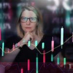 A woman looks quizzical as she looks at a graph of the share market.