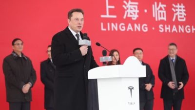 Elon Musk speaking at a Chinese event.