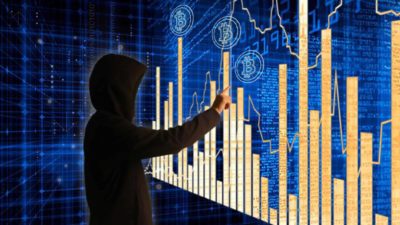 a mysterious person wearing a black hoodie points a finger to a vast illuminated graph tracking bitcoin value with bitcoin symbols floating above the chart.