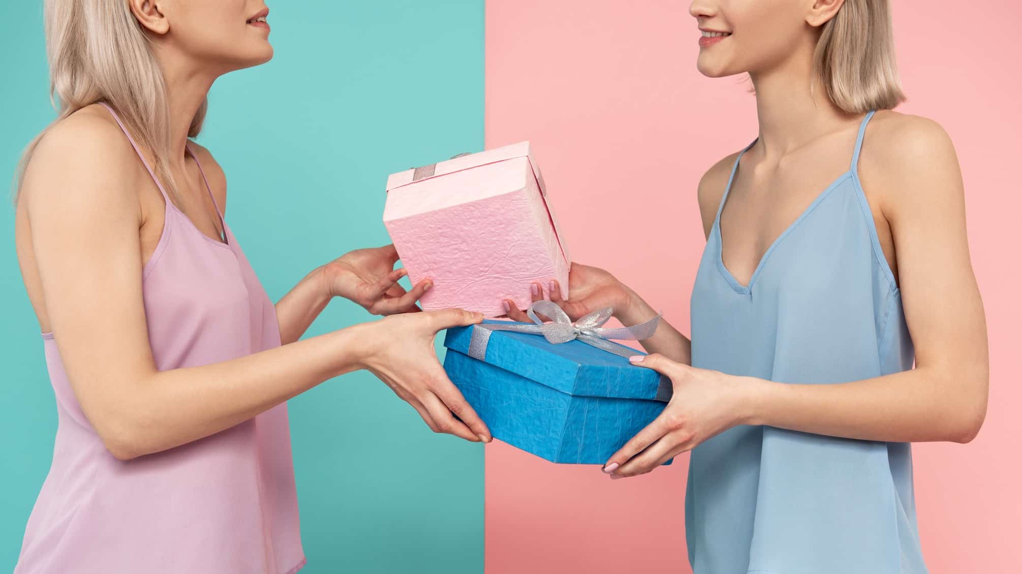 Two women exchange gifts.