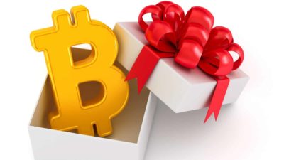 Bitcoin symbol inside an open gift box.